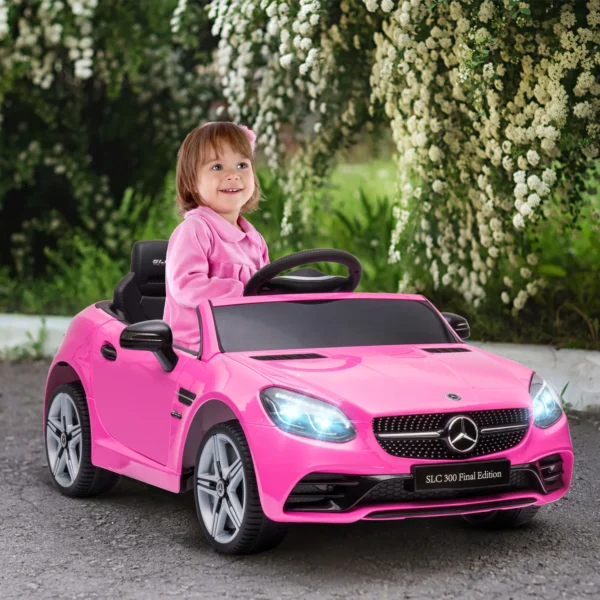 Kinder Elektroauto, Mit LED Scheinwerfern, Sicherheitsgurt, Hupe, Musik, 3 Bis 5 Km/h, Rosa, 107 X 62,5 X 44cm